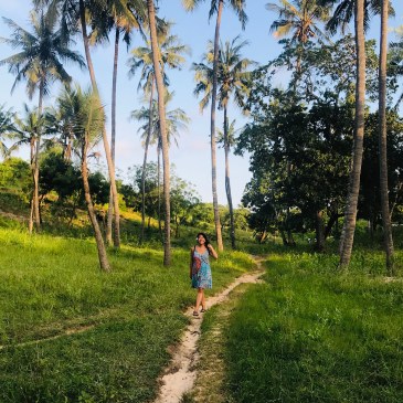 Girl in Kenya Africa palm trees