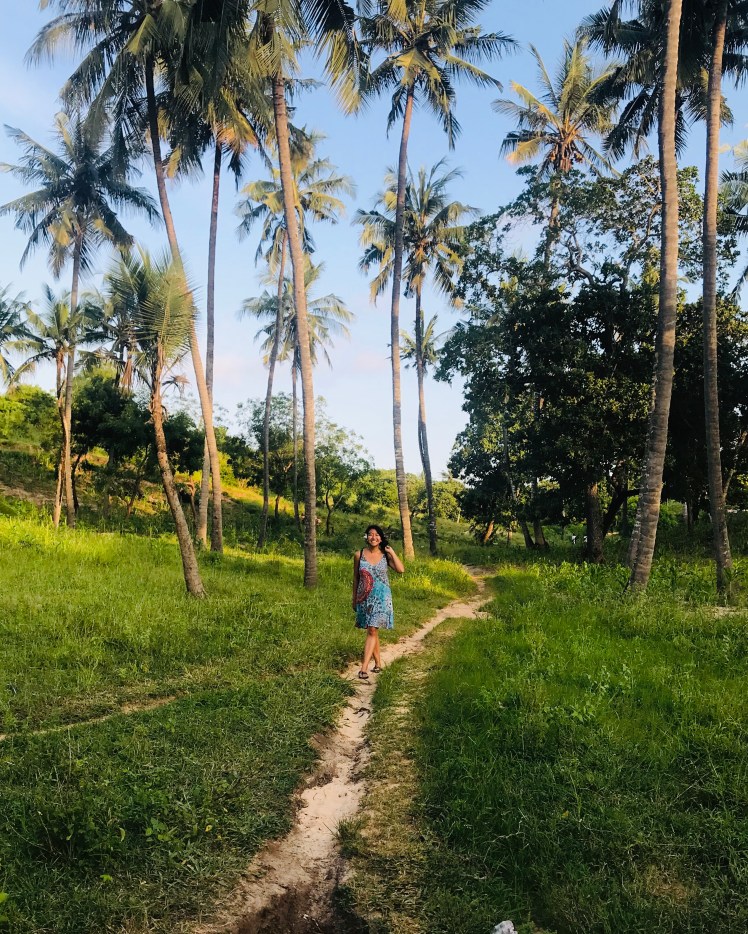 Girl in Kenya Africa palm trees