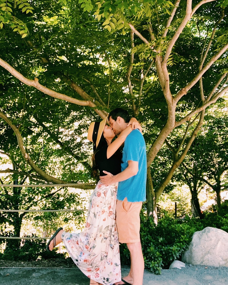Couple kissing under tree