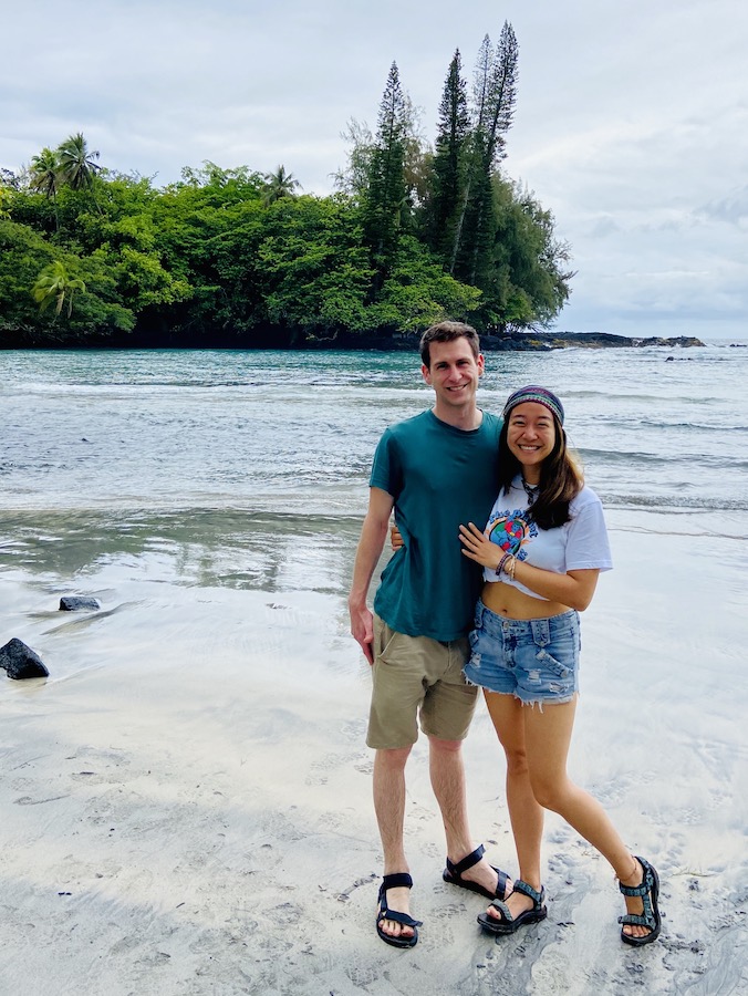 Couple on beach after long hike 