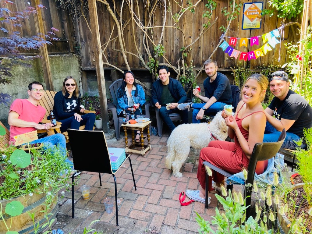 Guests at outdoor garden party for birthday