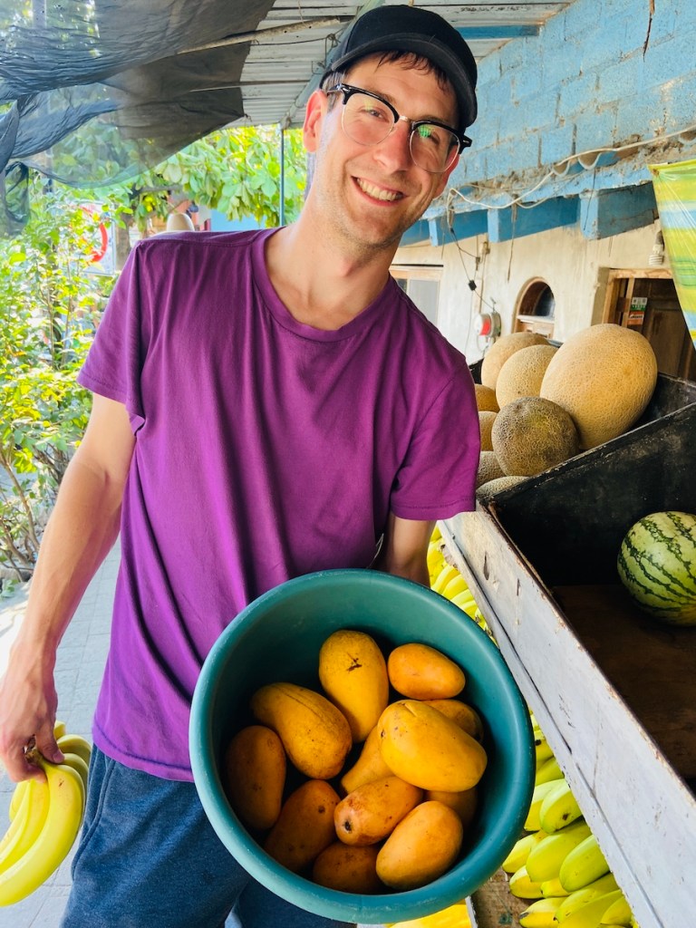 Buying mangos at a local produce stand in Mexico