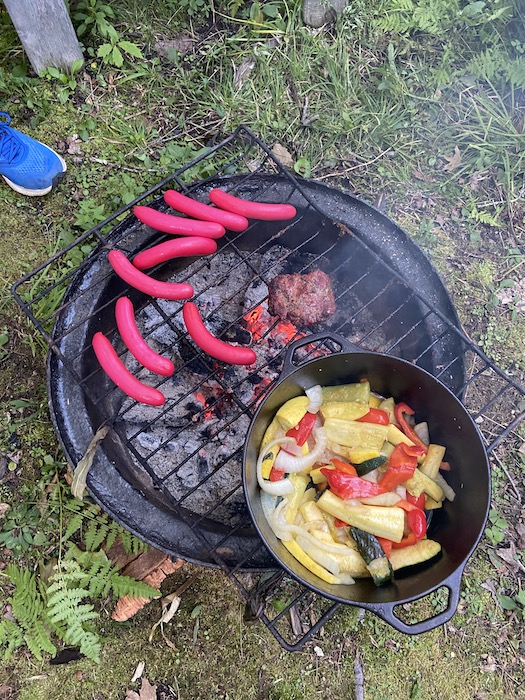 Grilling over the fire with maine pink hot dogs