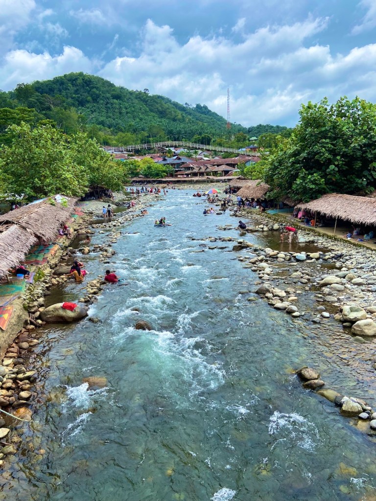 locals swimming in Bukit Lawang river
